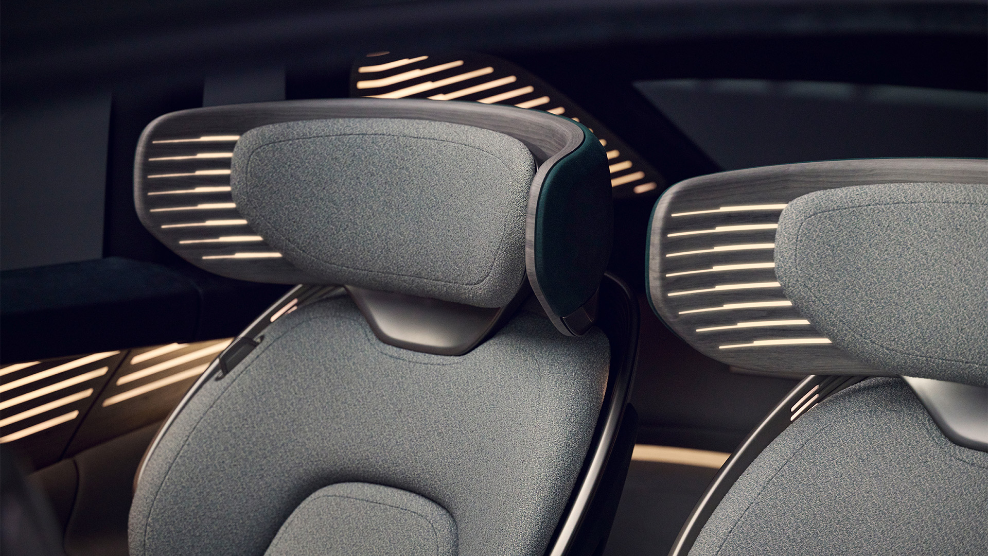 A close-up inside the Audi urbansphere concept of two seats with light elements in the headrest area.